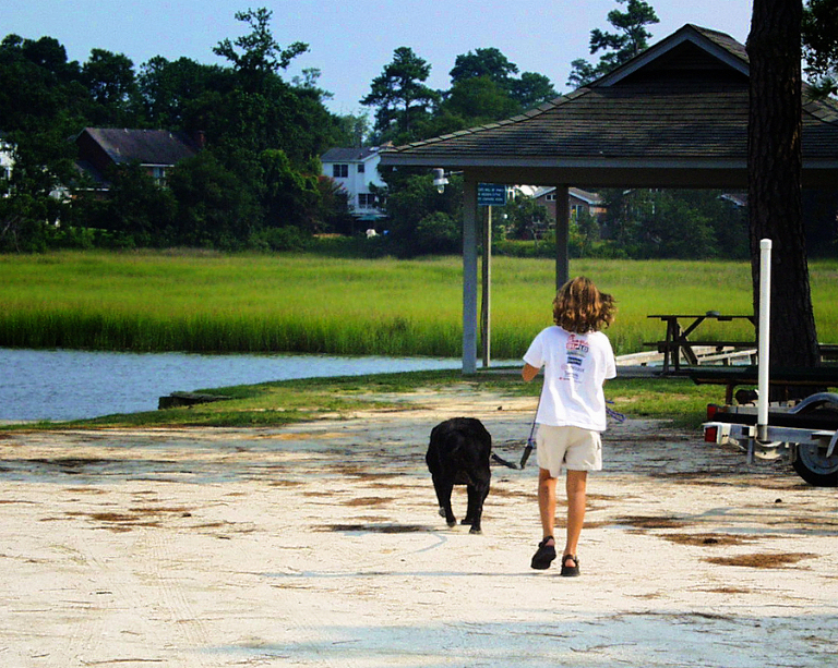Shadow, with my niece, Carolyn, in Charleston, SC, summer of 2001. Shadow, Mascha and I drove across country from San Diego, CA, to Charleston, SC, then up to Chicago, and back to California following Route 66 all the way. In Los Angeles we rewarded his excellent travelling behavior with a hamburger from In-n-Out. He ate the entire thing in one bite. 